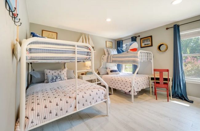 Bedroom with recessed lighting and wood finished floors | Image 11