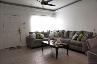 Living room featuring hardwood / wood-style floors and ceiling fan | Image 3