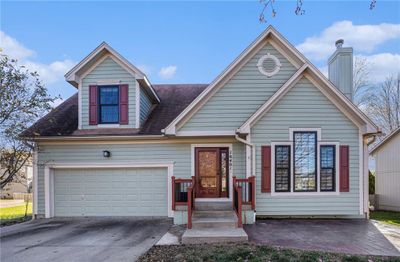 View of front of house featuring a garage | Image 1