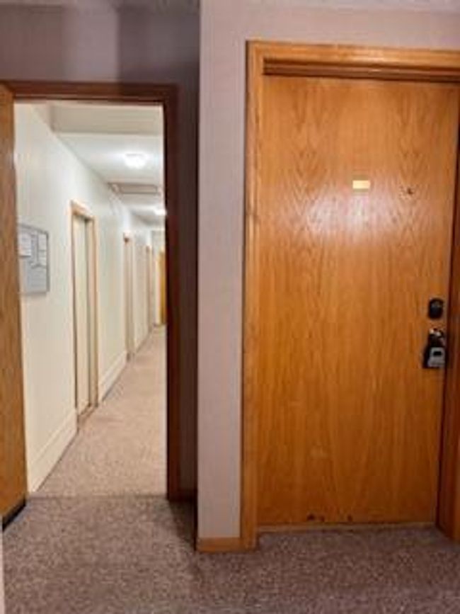 Hallway to garage & unit door | Image 5