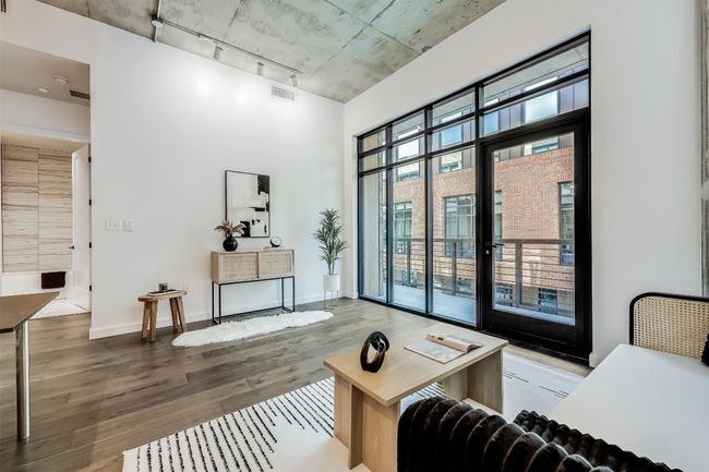 Towering 11-foot windows stretch from floor to ceiling, pulling in sunlight that shifts beautifully throughout the day and makes the entire space feel alive | Image 5