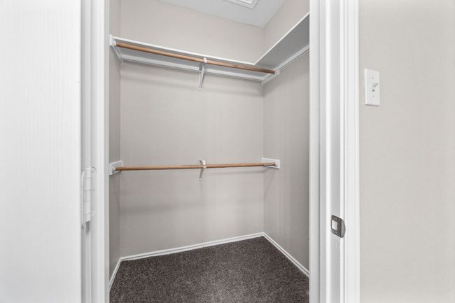 Spacious closet with carpet flooring | Image 25