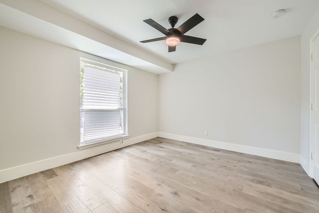 Empty room featuring baseboards, ceiling fan, and light wood finished floors | Image 21