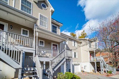 View of building exterior with a garage | Image 3