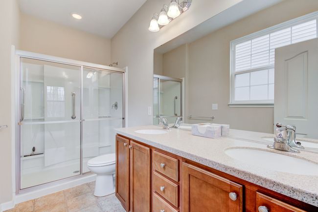 primary bathroom with dual sinks and shower | Image 26