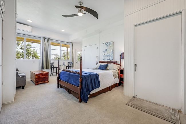 On the main level, the bonus living quarters include a sizeable Bedroom, small living area and lots of windows to capture views! "Draperies excluded" | Image 36