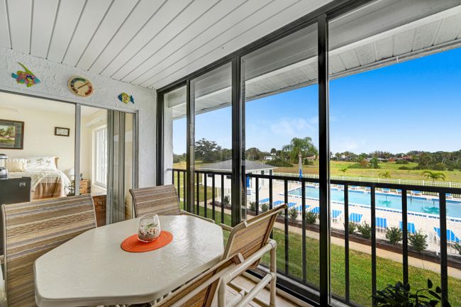 Gorgeous View from Balcony! Impact Glass Doors & Screen for Security & Breezes! | Image 26