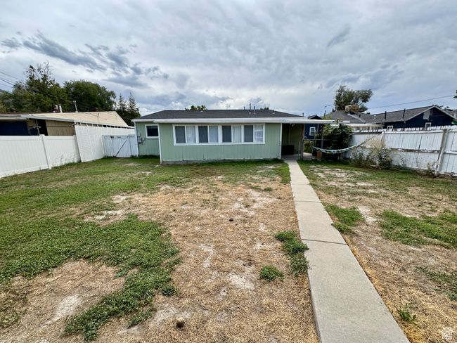 Exterior space featuring a front yard and a fenced backyard | Image 19