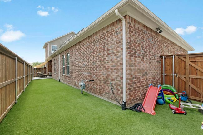 View of side of property with brick siding and a gate | Image 29