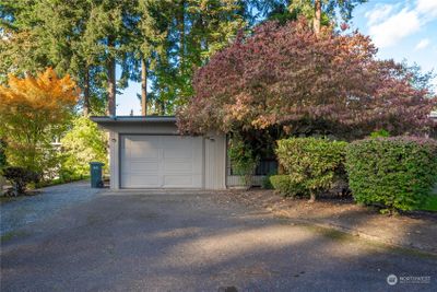 1 car garage with additional driveway parking. | Image 2