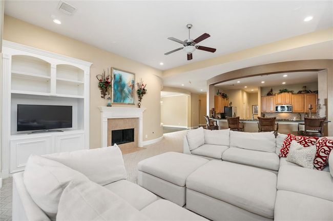 Whether you're hosting holiday gatherings or enjoying a quiet evening by the fire, this expansive formal living room sets the perfect tone. The natural light pouring through the bay window creates a bright, uplifting atmosphere, while the fireplace invites cozy moments all year long. | Image 13