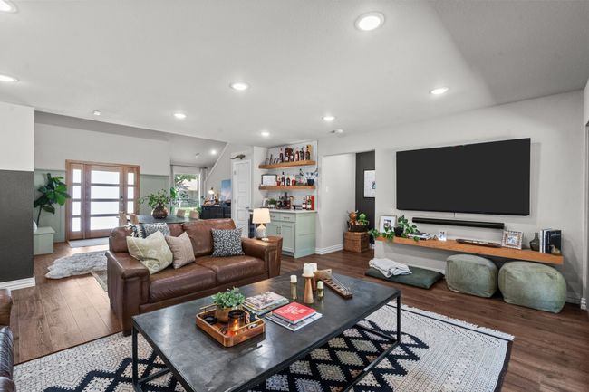 Living room featuring a dry bar, wood finished floors, and recessed lighting | Image 16