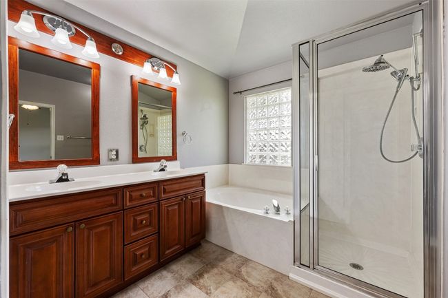 Separate garden tub and shower in primary bath | Image 15