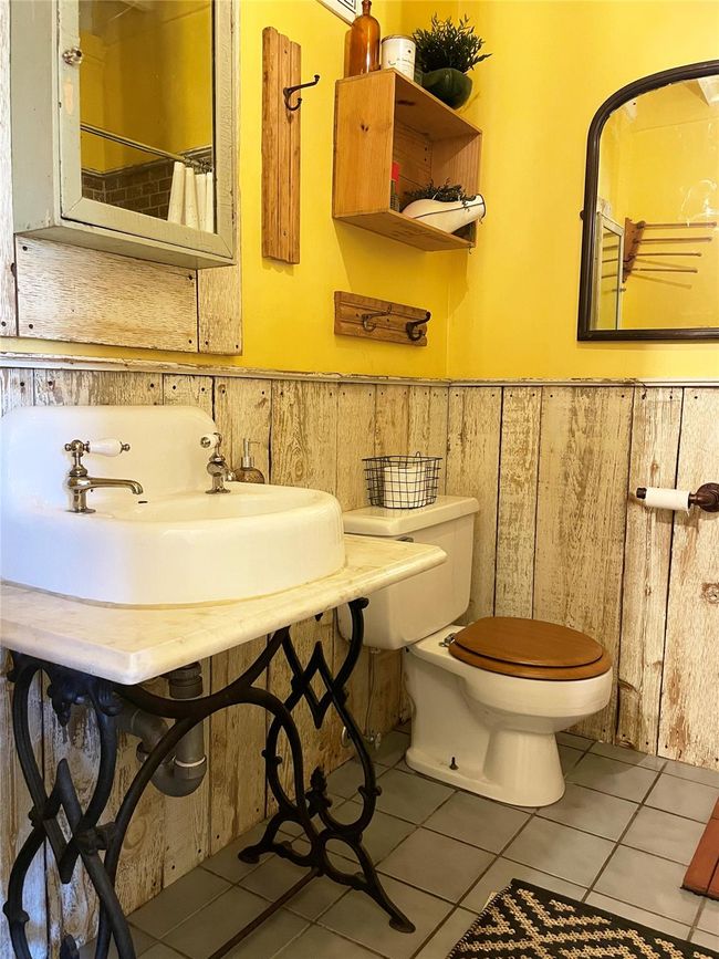 Bathroom with wainscoting and tile patterned floors | Image 20