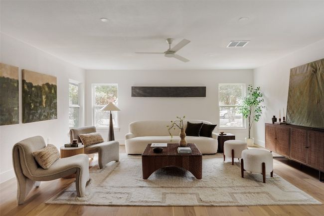 Living area with wood finished floors and a ceiling fan | Image 15