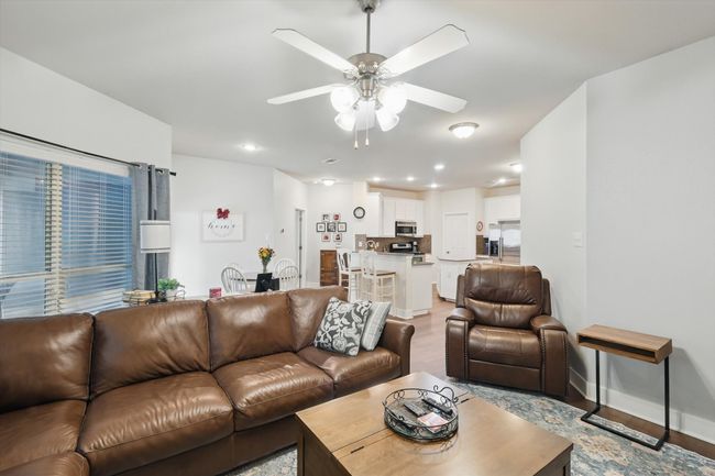 Living room featuring a ceiling fan, recessed lighting, and light wood-type flooring | Image 22