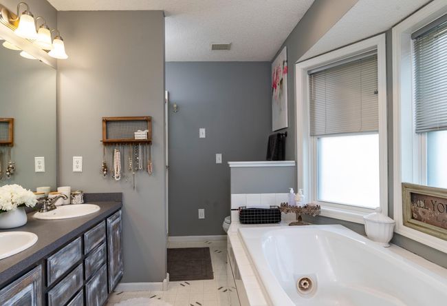 Luxurious owners bath with dual sinks, jetted tub and separate shower.jpg | Image 23