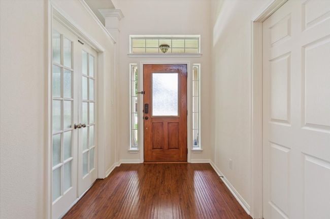 Entrance foyer featuring dark wood-style floors and baseboards | Image 5