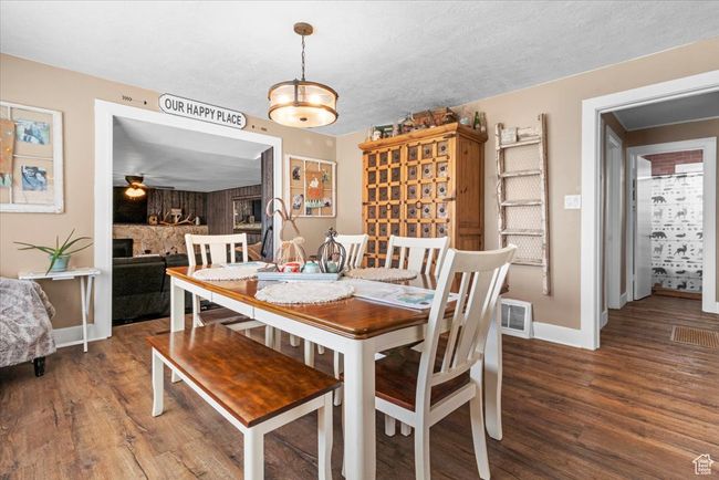 Dining room featuring a ceiling fan, visible vents, baseboards, and wood finished floors | Image 22