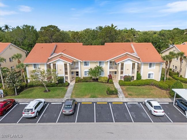 View of property featuring uncovered parking | Image 16