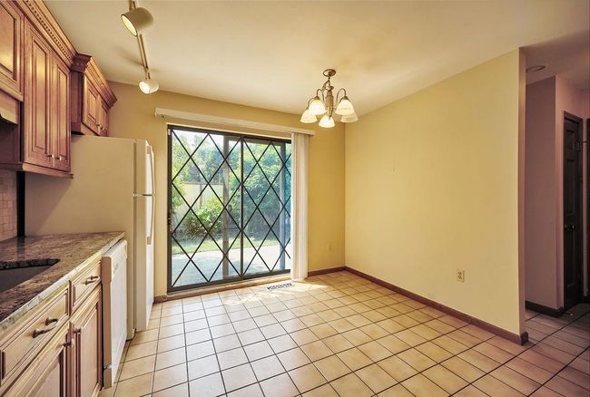 Kitchen looking at Table area | Image 8