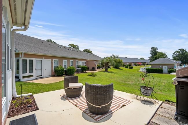 View of patio with an outdoor fire pit | Image 21