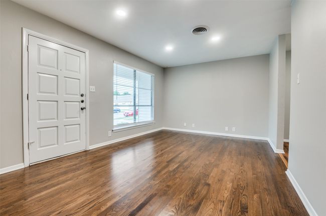Entrance with dark real wood flooring, baseboards, and recessed lighting | Image 4