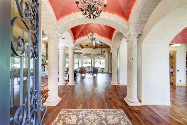 The foyer includes an abundance of custom imported Canterra columns and opens up to several main rooms of the home. | Image 6