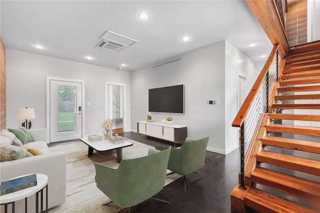 Living room with recessed lighting, stairway, attic access, and concrete flooring | Image 22