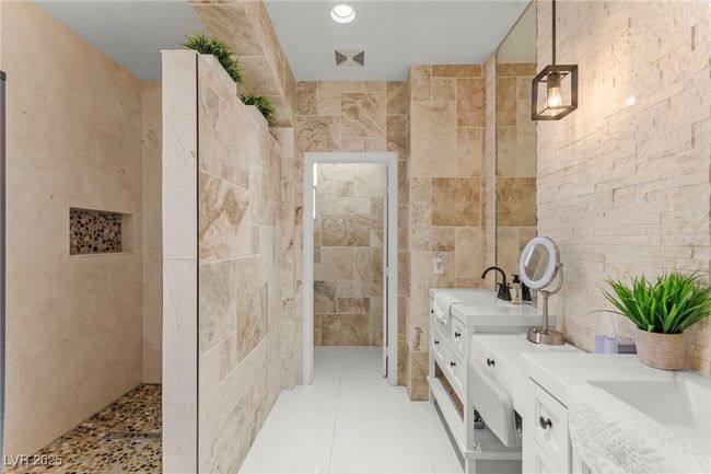Bathroom with tile walls, vanity, and a walk in shower | Image 27