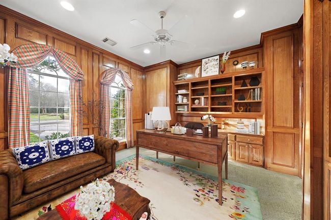 The downstairs study offers a serene view onto the front gardens of the estate. | Image 41