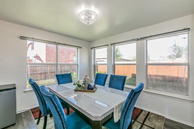 Dining space featuring wood finished floors | Image 6