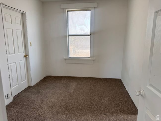 Spare room featuring carpet flooring and a wealth of natural light | Image 31