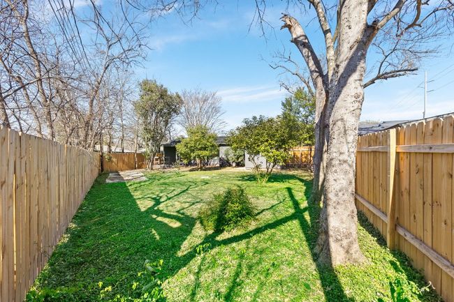 View of fenced backyard | Image 33
