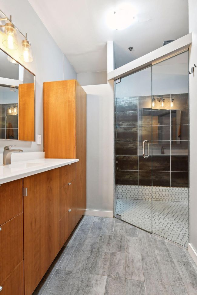 Huge tiled shower with rainfall shower head. Feel like you're at a spa! | Image 13