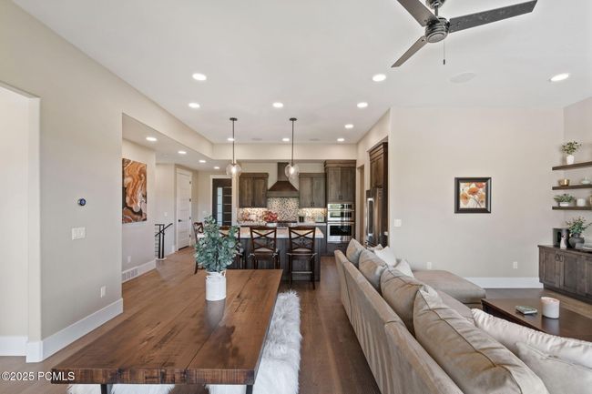 View from balcony to living room, kitchen and entry way | Image 7