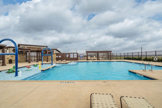 Pool featuring a patio area, playground community, fence, and a pergola | Image 28