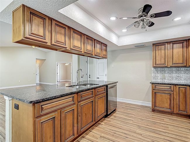 Kitchen center island with upper cabinets that open on both sides. | Image 38