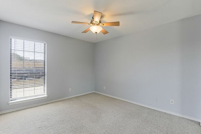 Spare room with baseboards, a ceiling fan, and plenty of natural light | Image 18