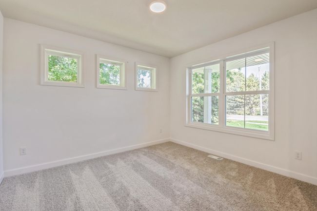(*Photo of actual home) The flex space located just off the foyer is the perfect place for a home office | Image 9
