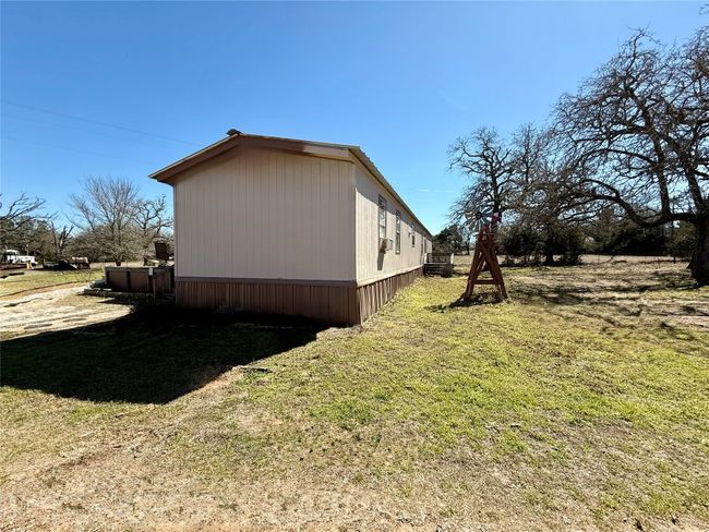 View of property exterior featuring a yard | Image 4