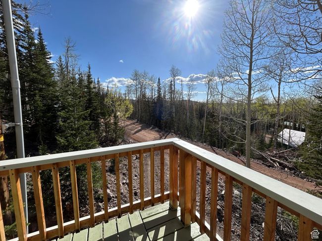 Balcony with a view of trees | Image 34