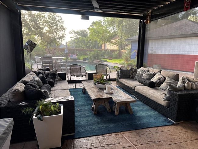 A touch of the remote control button and your porch is enclosed. | Image 43
