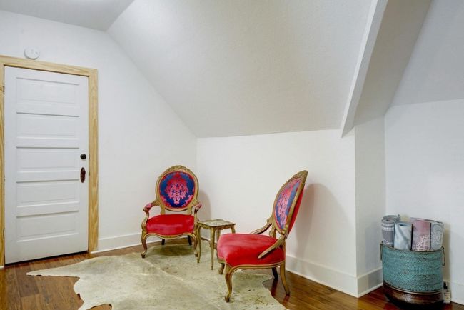Second story sitting area featuring lofted ceiling and wood finished floors | Image 28