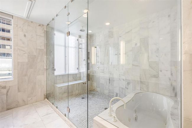 Massive frameless marble shower with oversized wet area. | Image 22