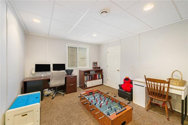 Carpeted office space featuring recessed lighting and a paneled ceiling | Image 19