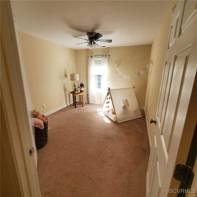 Unfurnished bedroom with baseboards, carpet floors, and ceiling fan | Image 48
