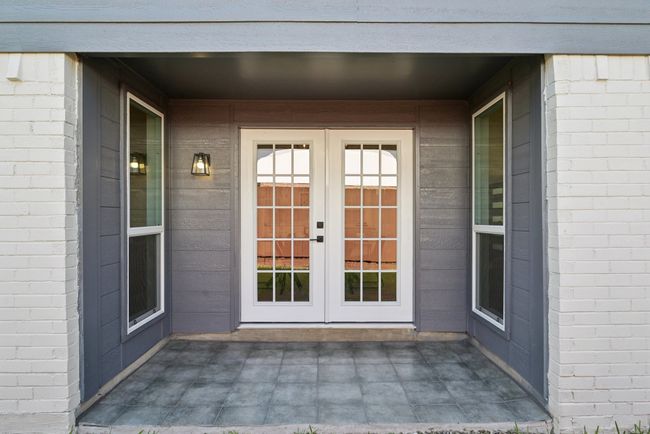 View of exterior entry featuring french doors and a patio area | Image 38