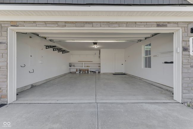 2 Car Garage with Ample storage space with built in shelving | Image 37