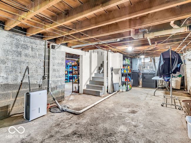 below grade area with stairs and washing machine and dryer | Image 19